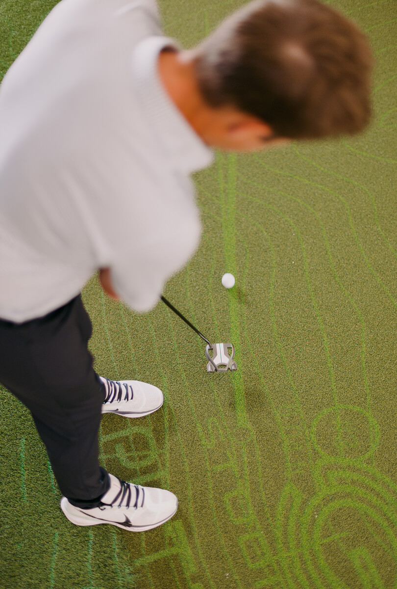Putting green at Studio Golf Newport Beach