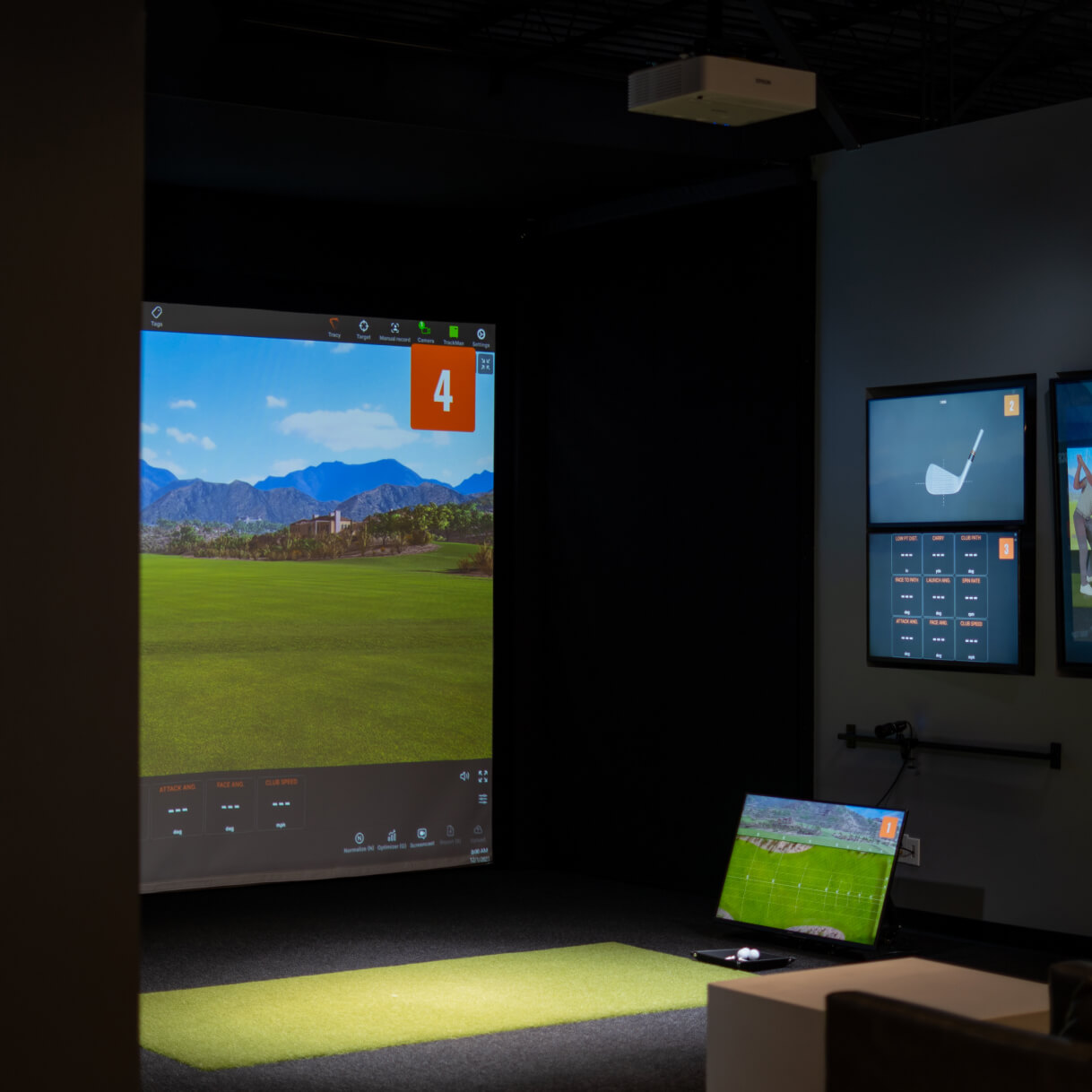 Climate-controlled Studio Golf practice bay with TrackMan, Sportsbox AI, and PuttView technology.